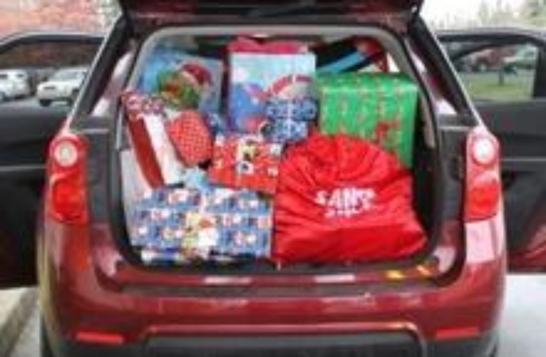 A red car filled with presents