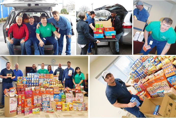 People volunteering at a food drive 